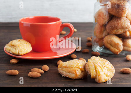 Sweet cottage cheese cookies closeup with almonds in the background. Shallow depth of field Stock Photo