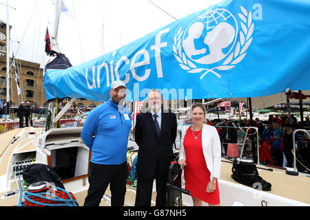 (left-right) Skipper Jim Prendergast, Unicef UK Director David Bull and Deputy Executive Director, Fundraising at Unicef UK Catherine Cottrell poses during day three of the Clipper Round the World Yacht Race Launch at St Katharine Docks, London. Stock Photo