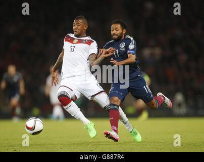 Germany's Jerome Boateng (left) and Scotland's Ikechi Anya battle for the ball during the UEFA European Championship Qualifying match at Hampden Park, Glasgow. PRESS ASSOCIATION Photo. Picture date: Monday September 7, 2015. See PA story SOCCER Scotland. Photo credit should read: Danny Lawson/PA Wire. RESTRICTIONS: Use subject to restrictions. . Commercial use only with prior written consent of the Scottish FA. Call +44 (0)1158 447447 for further information. Stock Photo