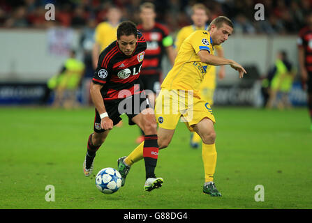 Bayer 04 Leverkusen's Javier Hernandez, battles for possession of the ball with FC BATE Borisov's Ilya Akeksievich, (right) Stock Photo