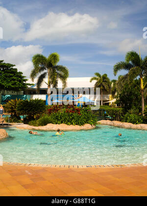 Relaxing in the pool at Daydream Island Resort; Whitsunday Islands, QLD, Australia. Stock Photo