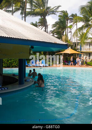 Relaxing by the pool at Daydream Island Resort; Whitsunday Islands, QLD, Australia. Stock Photo