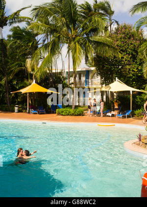 Relaxing in the pool at Daydream Island Resort; Whitsunday Islands, QLD, Australia. Stock Photo