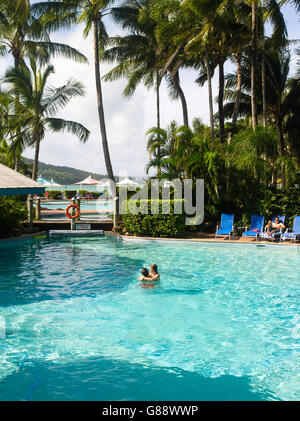 Relaxing in the pool at Daydream Island Resort; Whitsunday Islands, QLD, Australia. Stock Photo