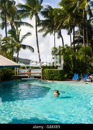 Relaxing in the pool at Daydream Island Resort; Whitsunday Islands, QLD, Australia. Stock Photo