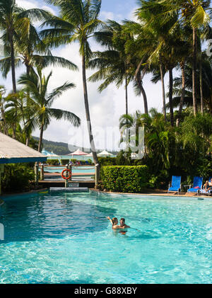 Relaxing in the pool at Daydream Island Resort; Whitsunday Islands, QLD, Australia. Stock Photo