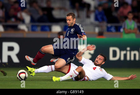 Scotland's Shaun Maloney (left) and Georgia's Guram Kashia battle for the ball during the UEFA European Championship Qualifying match at the Boris Paichadze Dinamo Arena, Tbilisi. Picture date: Friday September 4, 2015. See PA story SOCCER Georgia. Photo credit should read: Nick Potts/PA Wire. RESTRICTIONS: Use subject to restrictions. . Commercial use only with prior written consent of the Scottish FA. Call +44 (0)1158 447447 for further information. Stock Photo