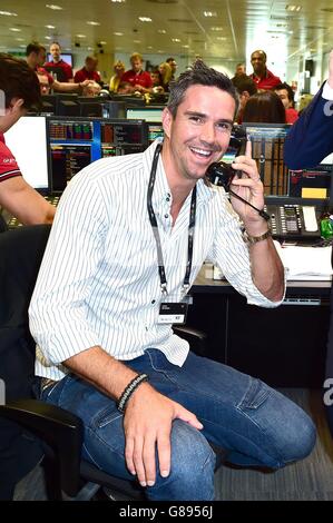 Kevin Pietersen takes part in the BGC Annual Global Charity Day at Canary Wharf in London. Stock Photo