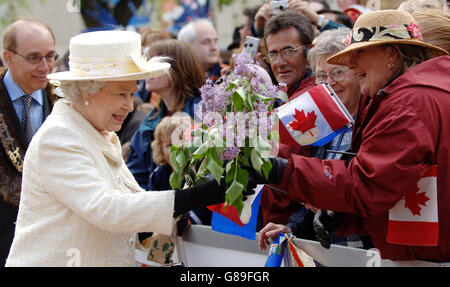 Queen Elizabeth II receives flowers in Sir Winston Churchill Square, Edmonton on the final day of the Royal visit to Canada. Stock Photo