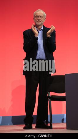 Labour Leader Jeremy Corbyn applauds General Secretary of Unite union Len McCluskey after his speech during the second day of the Labour Party conference in the Brighton Centre in Brighton, Sussex. Stock Photo
