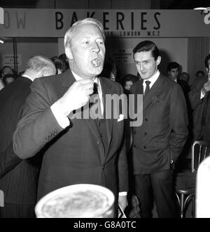 Edward Heath, Leader of the Opposition, samples some smoked eel at Olympia, London, where he was opening Hotelympia '66 - the International Hotel and Catering Exhibition. Stock Photo