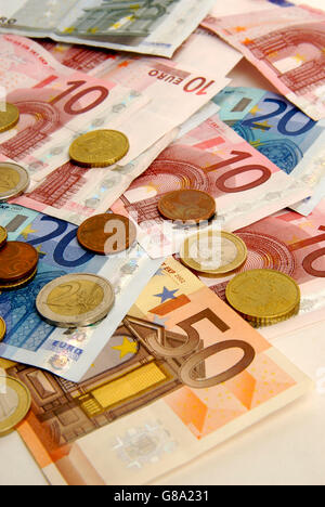 Euro notes and coins Stock Photo