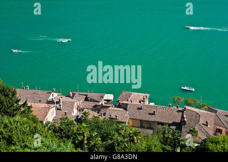 View over Morcote towards boats on Lake Lugano, Lago di Lugano, Ticino, Switzerland, Europe Stock Photo
