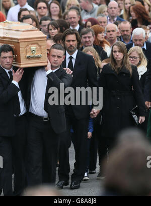 Jim Carrey joins mourners behind the coffin of ex-girlfriend Cathriona White to Our Lady of Fatima Church, in her home village of Cappawhite, Co Tipperary ahead of her funeral. Stock Photo