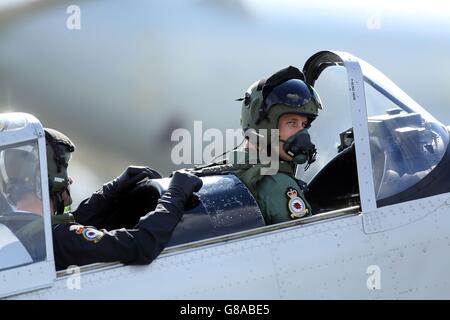 The Duke of Cambridge (right) in the cockpit of a Chipmunk plane with Squadron Leader Duncan Mason during a visit to RAF Coningsby, Lincolnshire. Stock Photo