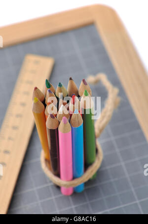 colorful pencils and slate on a wooden rustic background Stock Photo ...