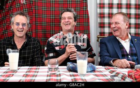 Bay City Rollers (left to right) Stuart Wood, Les McKeown and Alan Longmuir toast with milk as they make the announcement of their reunion at Central Hotel in Glasgow. Stock Photo