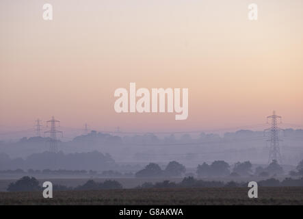 A view over fields at dawn in Bolam Lake Country Park, Northumberland. Stock Photo