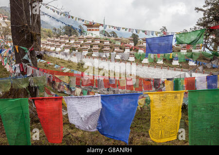 Colorful flags symbol of Buddhist prayers close to sacred temples Thimphu Wangdue Bhutan Asia Stock Photo