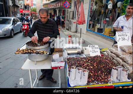 Street vendor selling roasted chestnuts in central Antalya Stock Photo