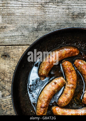 Fried Homemade Sausages in frying Pan Stock Photo