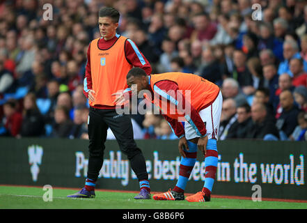 Aston Villa's Jack Grealish (left) and Leandro Bacuna warm up on the touchline during the Barclays Premier League match at Villa Park, Birmingham.
