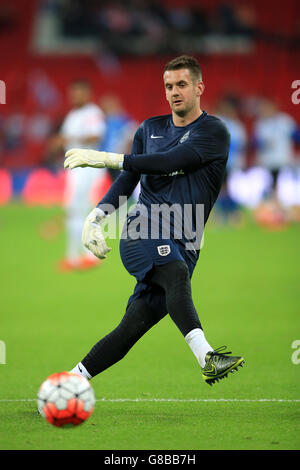 England goalkeeper Tom Heaton during the warm-up before the UEFA European Qualifying match at Wembley Stadium, London. Stock Photo