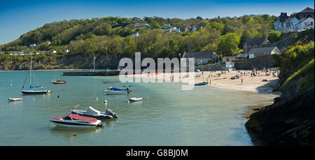 UK, Wales, Ceredigion, New Quay, visitors on Harbour Beach, panoramic Stock Photo