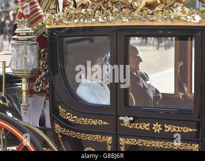 Peng Liyuan, the wife of the Chinese President Xi Jinping rides in a carriage with the Duke of Edinburgh along The Mall in London during the first day of their state visit to the UK. Stock Photo