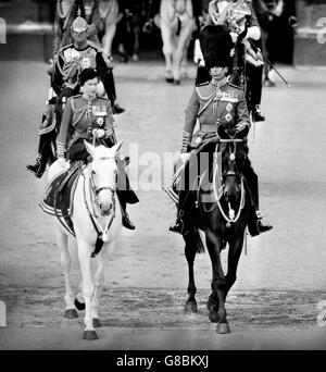Queen Elizabeth II and Prince Philip, Duke of Edinburgh leaving Buckingham Palace on horseback on their way to the Horse Guards Parade for the Trooping the Colour ceremony to mark the Queen's official birthday. Stock Photo