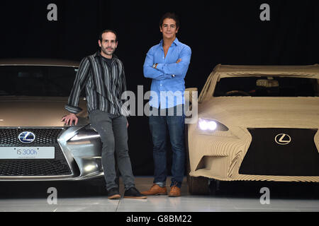 Ruben Marcos of Scales and Models (left) and Daniel Ryan of LaserCut Works, pose next to the full-size origami inspired Lexus IS Saloon (right) they help build, as it is unveiled at Toyota's Headquarters in Surrey. Stock Photo