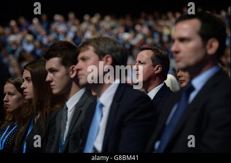 Prime Minister David Cameron watches the Chancellor of the Exchequer, George Osborne address the Conservative Party annual conference in Manchester. Stock Photo