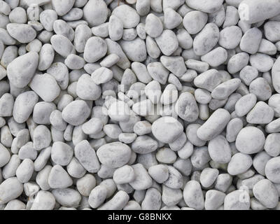 Light grey pebbles background Stock Photo