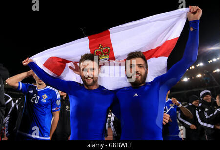 Northern Ireland's Oliver Norwood (left) and Stuart Dallas celebrate at the end of the match during the European Championship Qualifying match at the Helsinki Olympic Stadium, Finland. Stock Photo