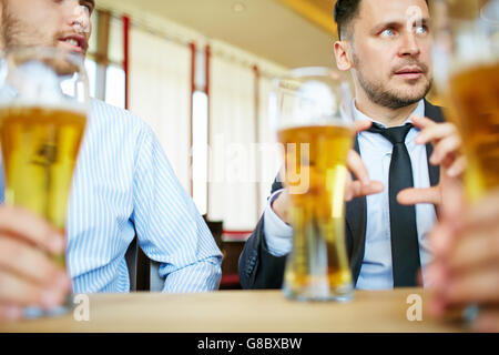Conversation in pub Stock Photo