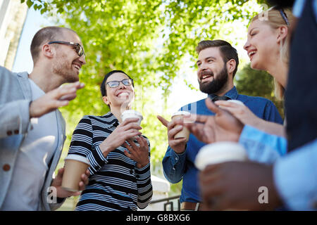 Sharing and discussing ideas at outdoor meeting Stock Photo