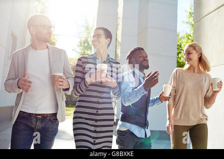 Interacting at outdoor meeting and having coffee break Stock Photo