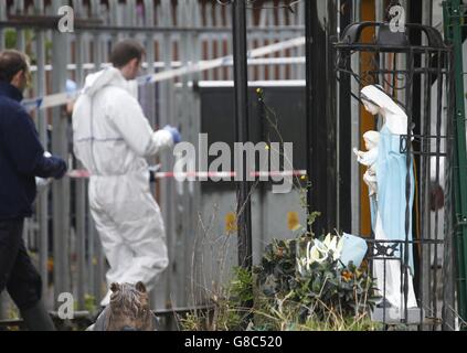 Emergency services at a halting site for travellers in Carrickmines, south Dublin, where ten people from two families, including a mother, father and a five-month-old baby, have been killed in a fire. Stock Photo