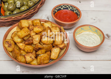 Spanish tapa patatas bravas with hot sauce and aioli Stock Photo