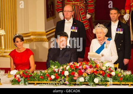 The Duchess of Cambridge and Chinese President Xi Jinping listen as Queen Elizabeth II speaks at a state banquet at Buckingham Palace, London, during the first day of his state visit to the UK. Stock Photo