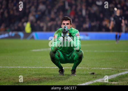Hull City goalkeeper Eldin Jakupovic faces away from the penalty shoot-out following the Capital One Cup, Fourth Round match at the KC Stadium, Hull. Stock Photo