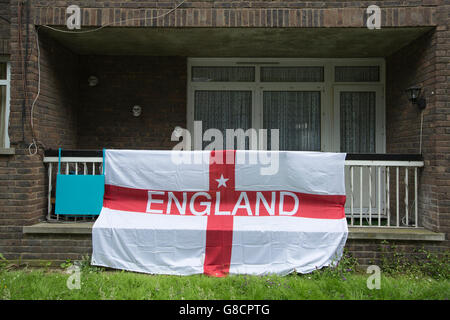 St Goerge's Cross (Cross of St George) flag outside a residential apartment block, London, England, UK Stock Photo