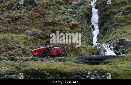 A vintage 1935 Austin Ulster 7 is driven up the quarry road at Honister Slate Mine, in Borrowdale, Keswick, Cumbria, as it takes part in the annual Lakeland Trials vintage car rally. Stock Photo
