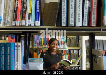 Female student browsing in the school library. England. UK Stock Photo