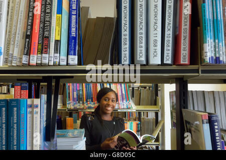 Female student browsing in the school library. England. UK Stock Photo