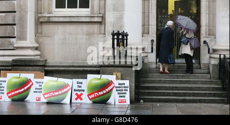 Members of the Debt &amp; Development Coalition Ireland holding a protest outside Department of Finance in Dublin where they are calling for the Public Accounts Committee to investigate the tax rulings system, by which they say Revenue gives away billions in revenues to Apple and other multinational corporations. Stock Photo