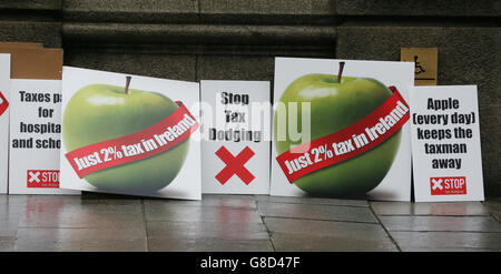 Members of the Debt & Development Coalition Ireland holding a protest outside Department of Finance in Dublin where they are calling for the Public Accounts Committee to investigate the tax rulings system, by which they say Revenue gives away billions in revenues to Apple and other multinational corporations. Stock Photo