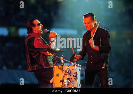 U2's singer Bono (left) and drummer Larry Mullen on stage during the second Irish date of their Vertigo Tour. Stock Photo