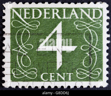 NETHERLANDS - CIRCA 1946: A stamp printed in the Netherlands showing it's value of 64 cent, circa 1946. Stock Photo