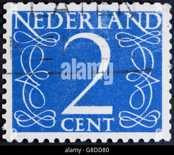 NETHERLANDS - CIRCA 1946: A stamp printed in the Netherlands showing it's value of 2 cent, circa 1946. Stock Photo